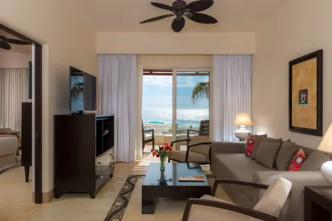 Oceanview Suite living room and balcony facing the ocean at Pueblo Bonito Pacifica Golf & Spa Resort.