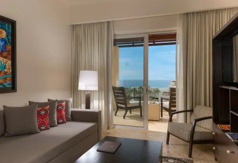 Oceanview Suite living room with balcony view at Pueblo Bonito Pacifica Golf & Spa Resort.