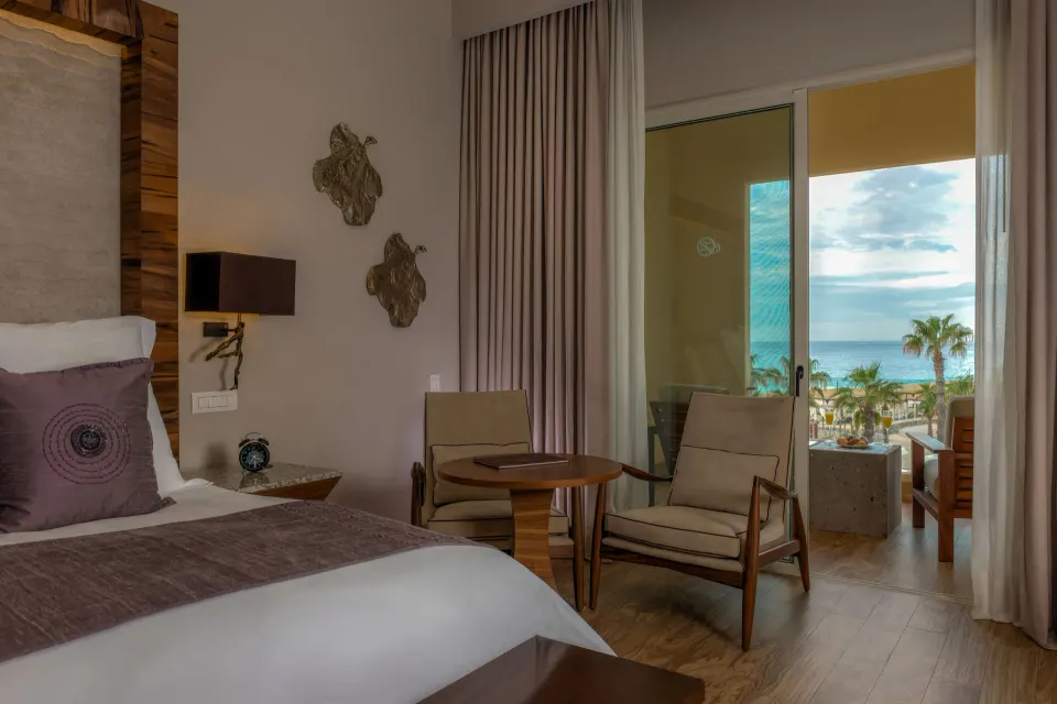 Towers Deluxe Ocean View Room seating and balcony at Pueblo Bonito Pacifica Golf & Spa Resort.