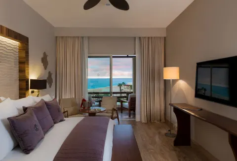Towers Ocean View Suite bedroom with balcony at Pueblo Bonito Pacifica Golf & Spa Resort.