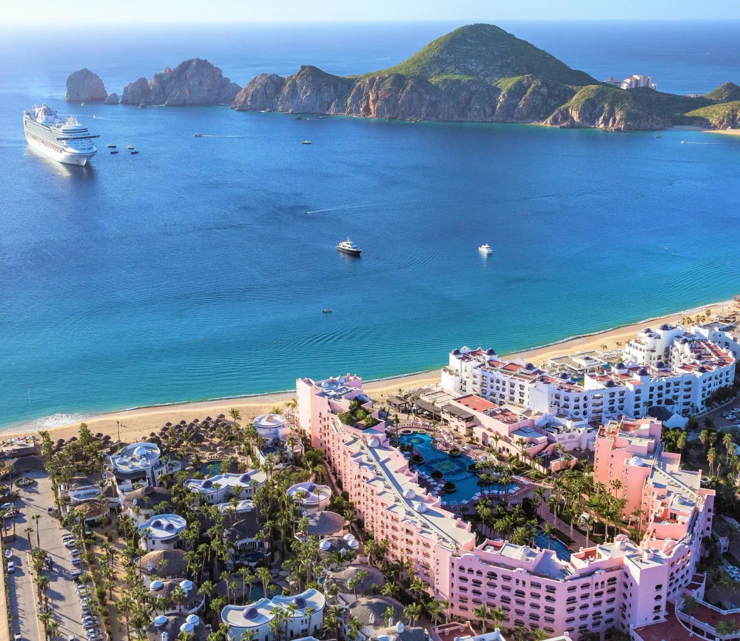 Aerial view of Pueblo Bonito Rose Resort and Spa beside the beach and blue bay.