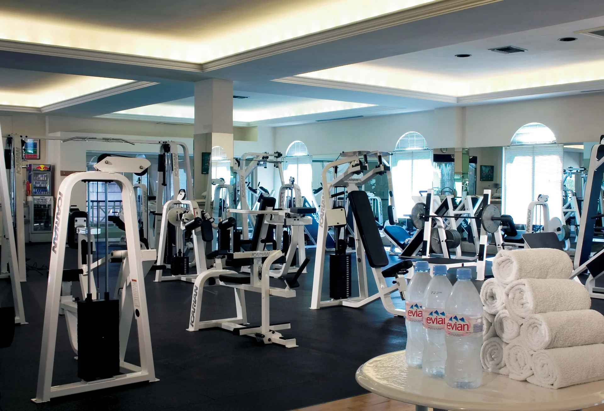 Fitness center with weight machines and towels at Pueblo Bonito Rose Resort and Spa.