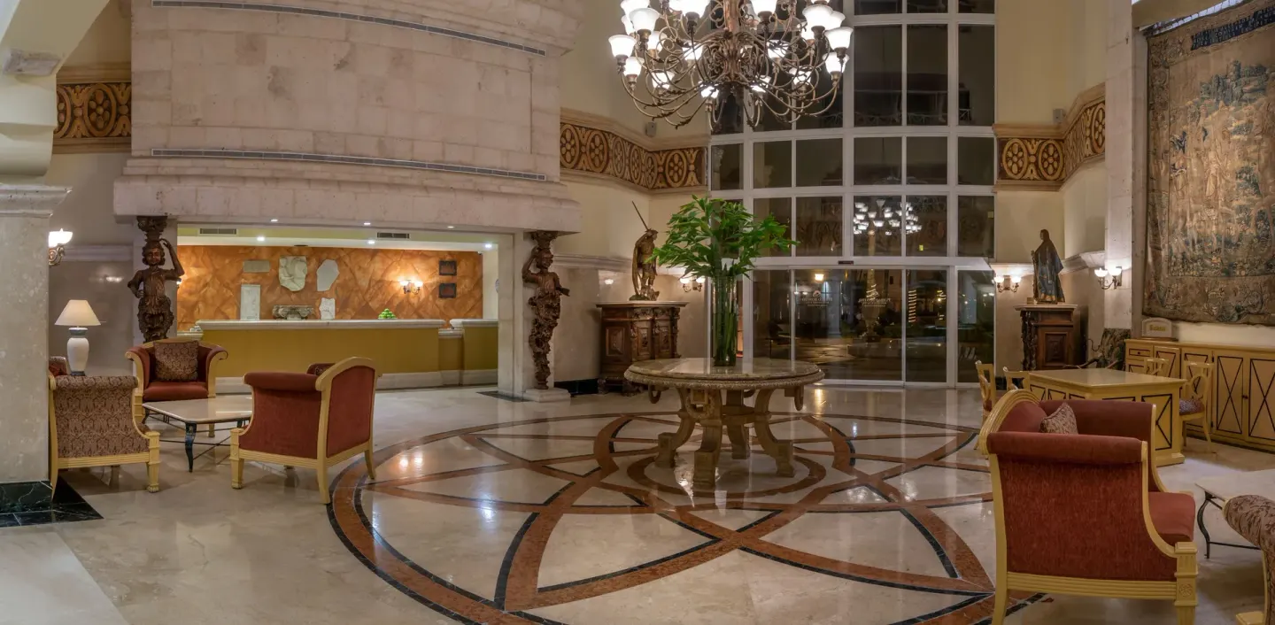 Lobby seating, chandelier, marble floor, and reception area at Pueblo Bonito Rose Resort and Spa.