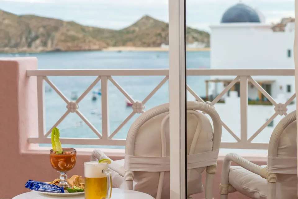 Junior Suite balcony with drinks and bay view at Pueblo Bonito Rose Resort and Spa.