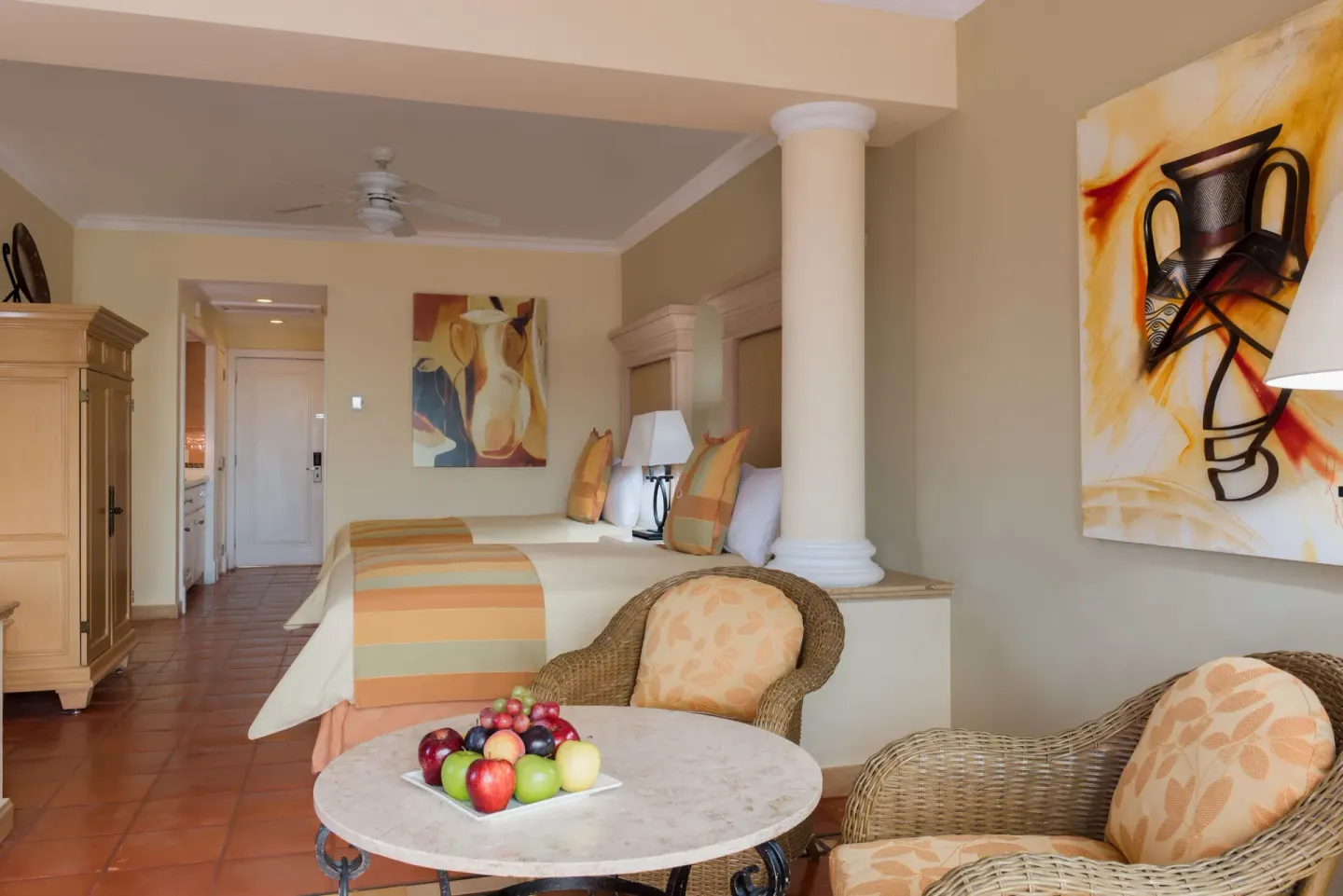 Junior Suite with two beds, seating, and table at Pueblo Bonito Rose Resort and Spa.