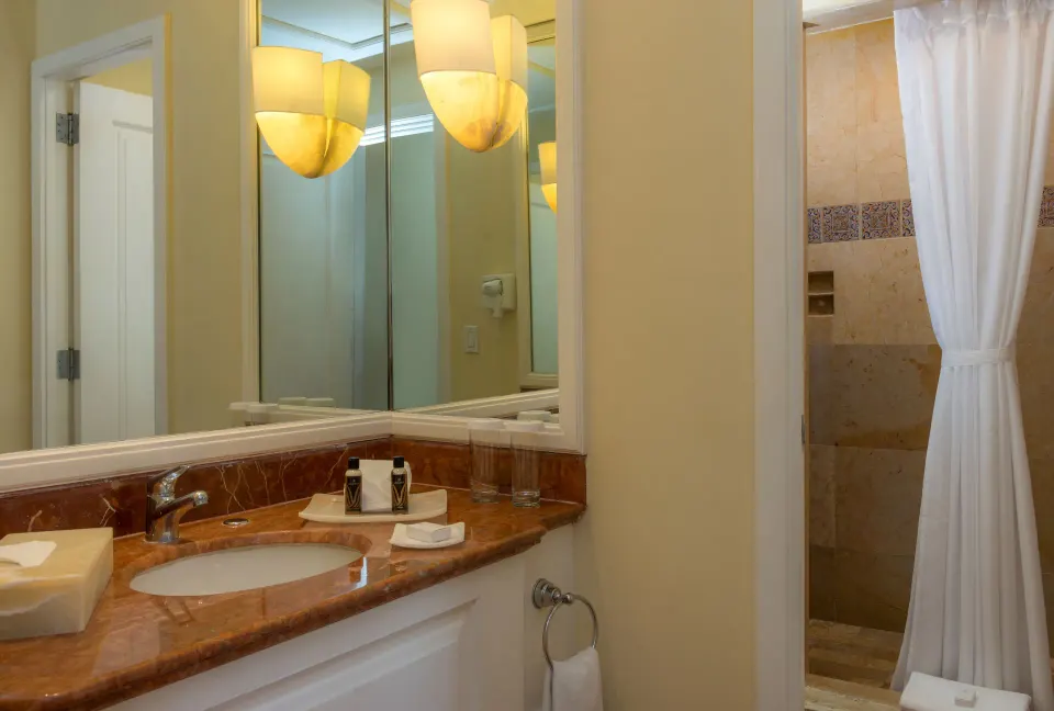 Luxury Suite bathroom vanity and curtained shower at Pueblo Bonito Rose Resort and Spa.