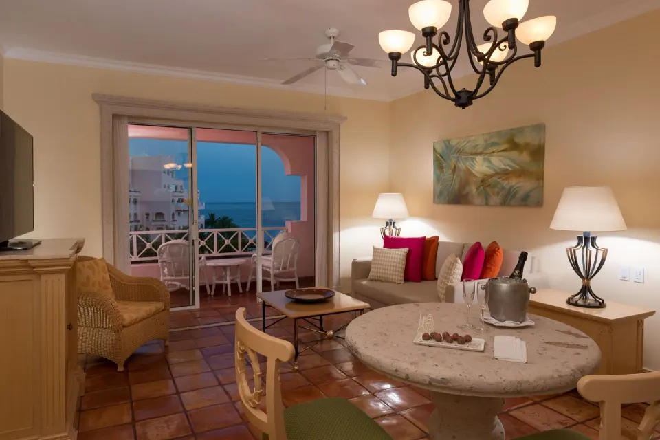 Luxury Suite living room with balcony seating and ocean view at Pueblo Bonito Rose Resort and Spa.