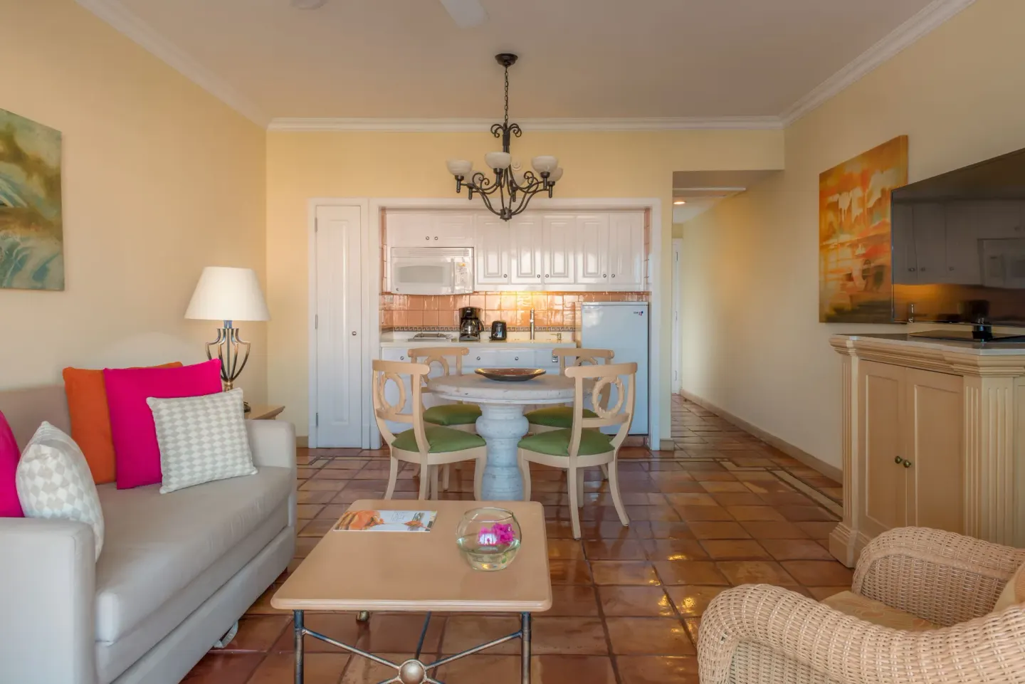 Luxury Suite sitting room with kitchenette, dining table and TV at Pueblo Bonito Rose Resort and Spa.