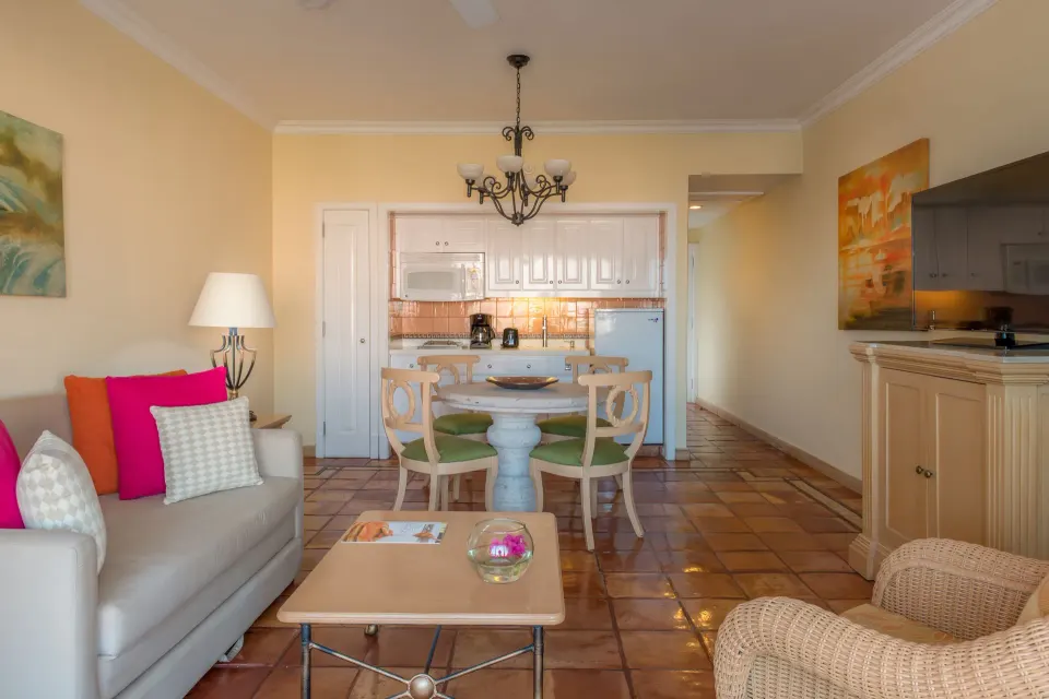 Luxury Suite sitting room with kitchenette, dining table and TV at Pueblo Bonito Rose Resort and Spa.