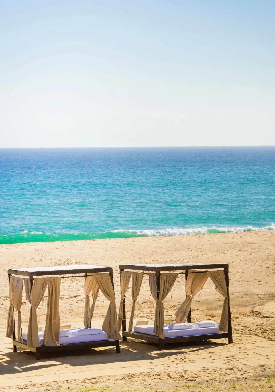 Beach cabanas facing the ocean at Pueblo Bonito Sunset Beach Golf & Spa Resort.
