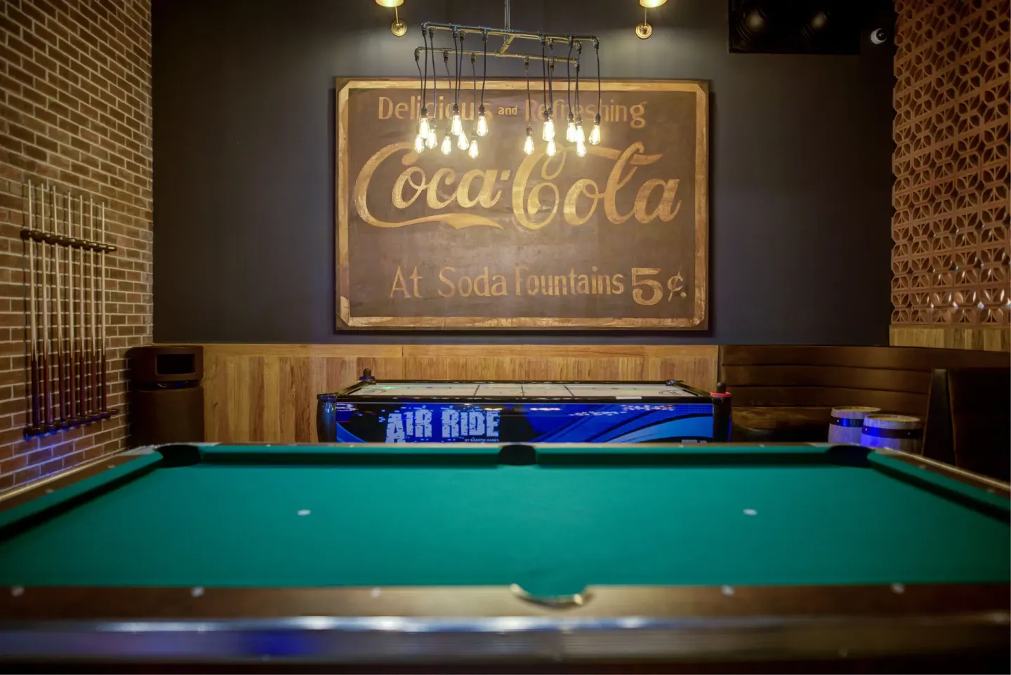 Pool table and air hockey table in the game room at Pueblo Bonito Sunset Beach Golf & Spa Resort.