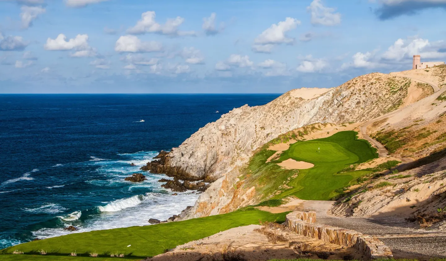 Clifftop golf green above the ocean near Pueblo Bonito Sunset Beach Golf & Spa Resort.