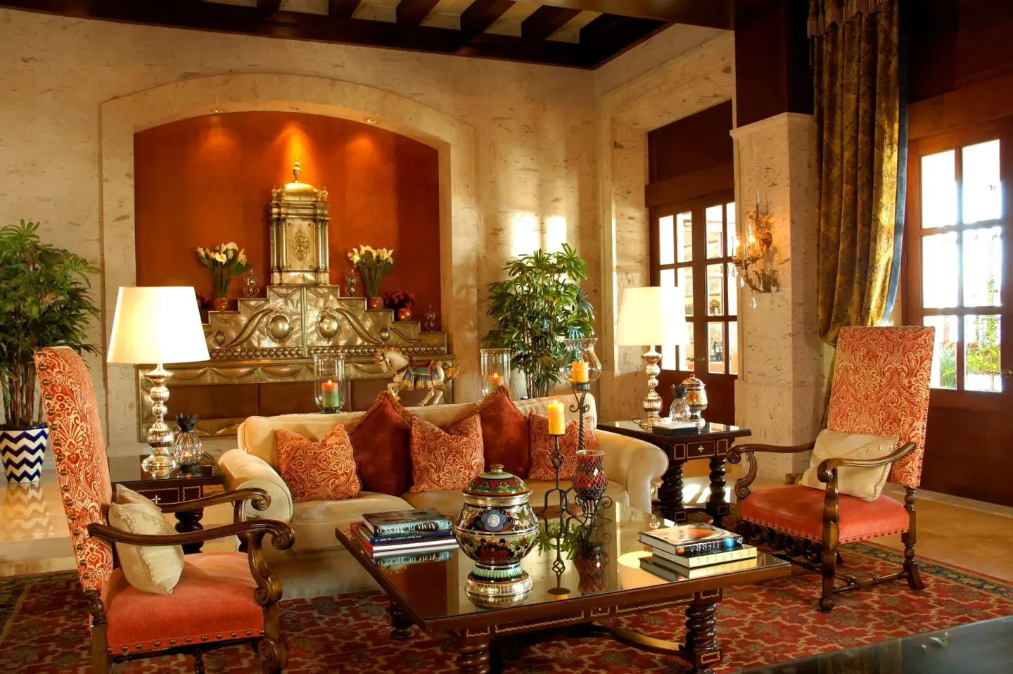 Formal lobby sitting area with carved furnishings at Pueblo Bonito Sunset Beach Golf & Spa Resort.