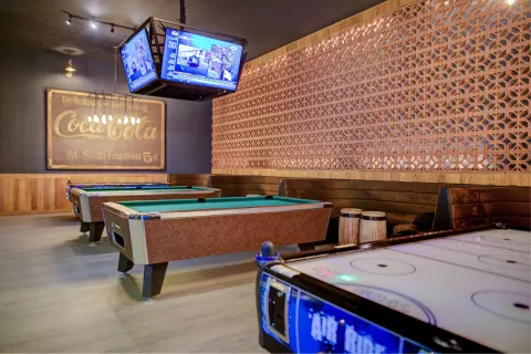 Pool tables and air hockey in the game room at Pueblo Bonito Sunset Beach Golf & Spa Resort.
