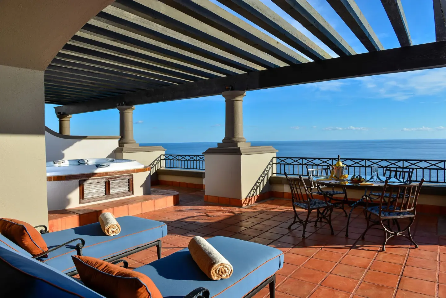 Private oceanview terrace with loungers at Pueblo Bonito Sunset Beach Golf & Spa Resort.