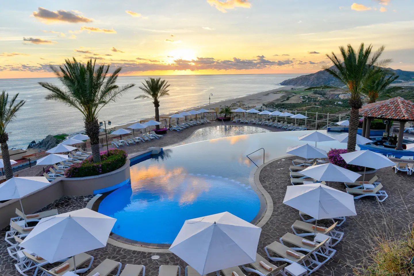 Sunset pool terrace overlooking the ocean at Pueblo Bonito Sunset Beach Golf & Spa Resort.