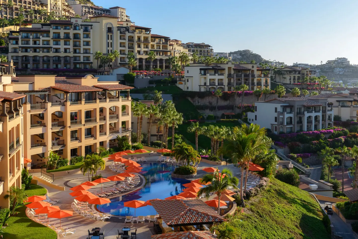 Terraced resort buildings and a pool at Pueblo Bonito Sunset Beach Golf & Spa Resort.