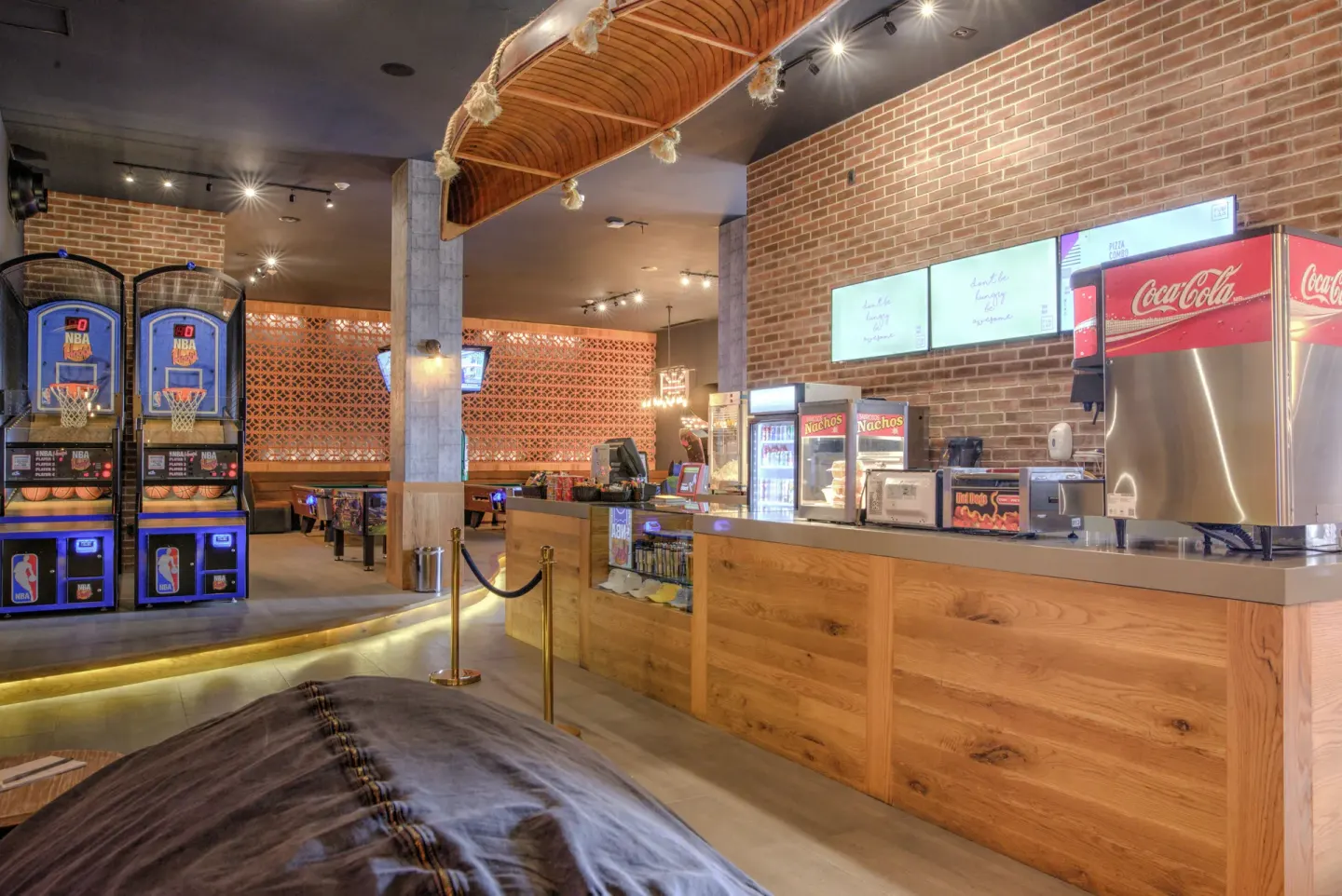 Sports bar counter and arcade games at Pueblo Bonito Sunset Beach Golf & Spa Resort.