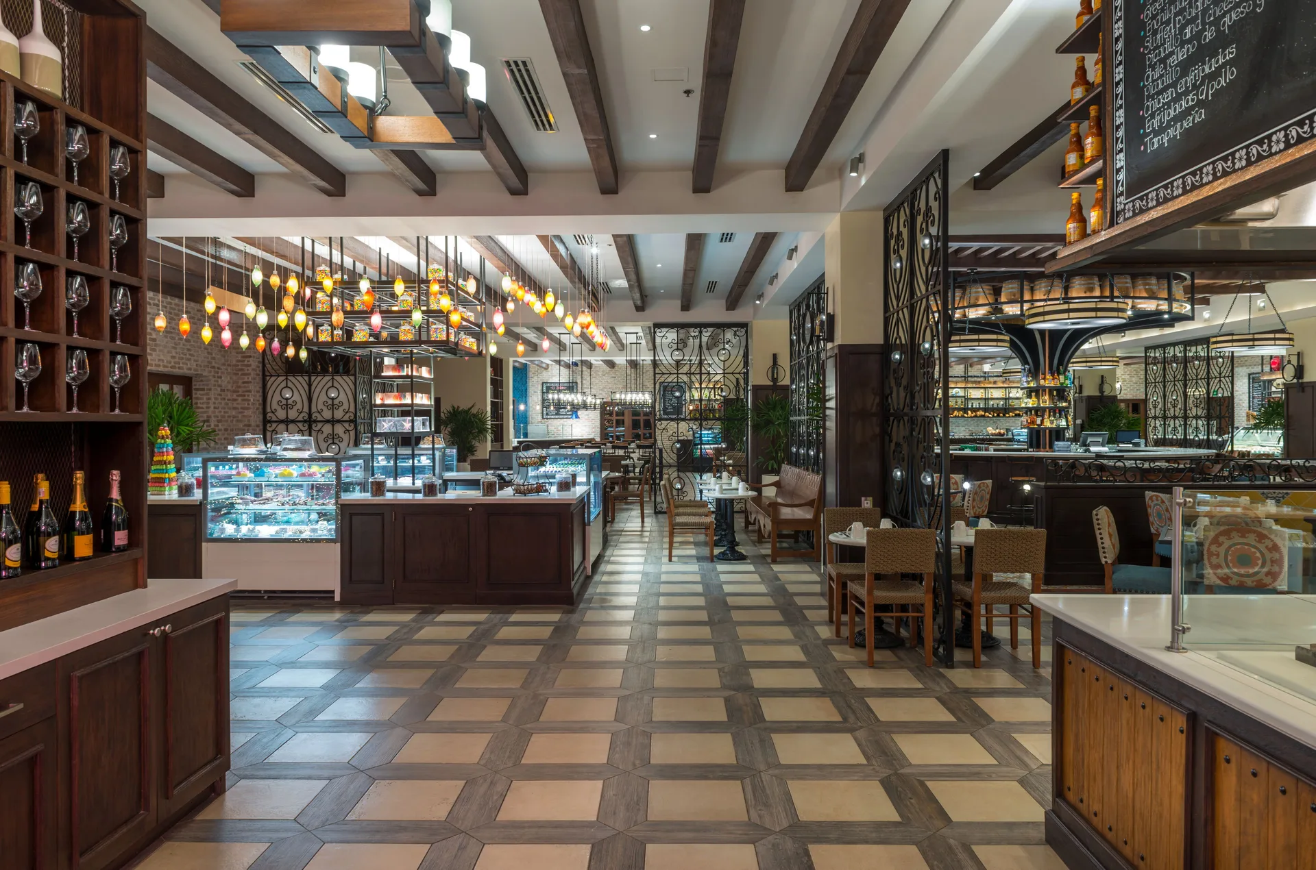 Food hall with display cases and seating at Pueblo Bonito Sunset Beach Golf & Spa Resort.