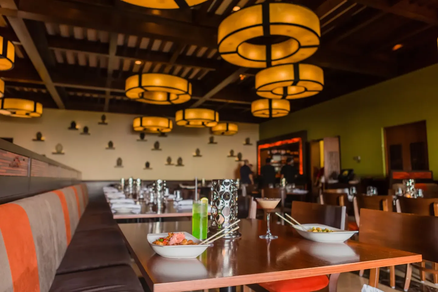 Asian-fusion dining room with plated dishes at Pueblo Bonito Sunset Beach Golf & Spa Resort.
