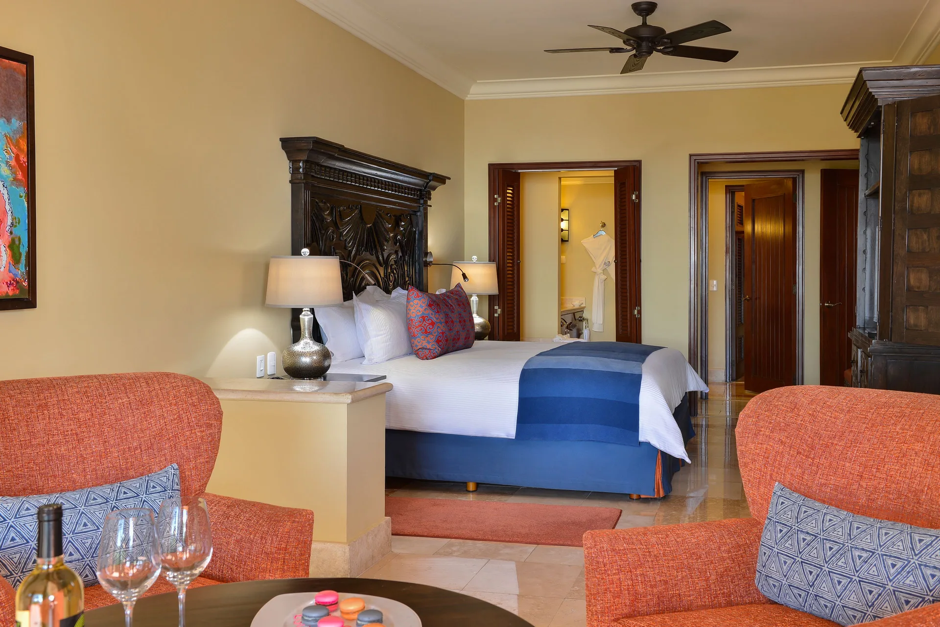 Executive Suite Ocean View king bed and sitting area at Pueblo Bonito Sunset Beach Golf & Spa Resort.