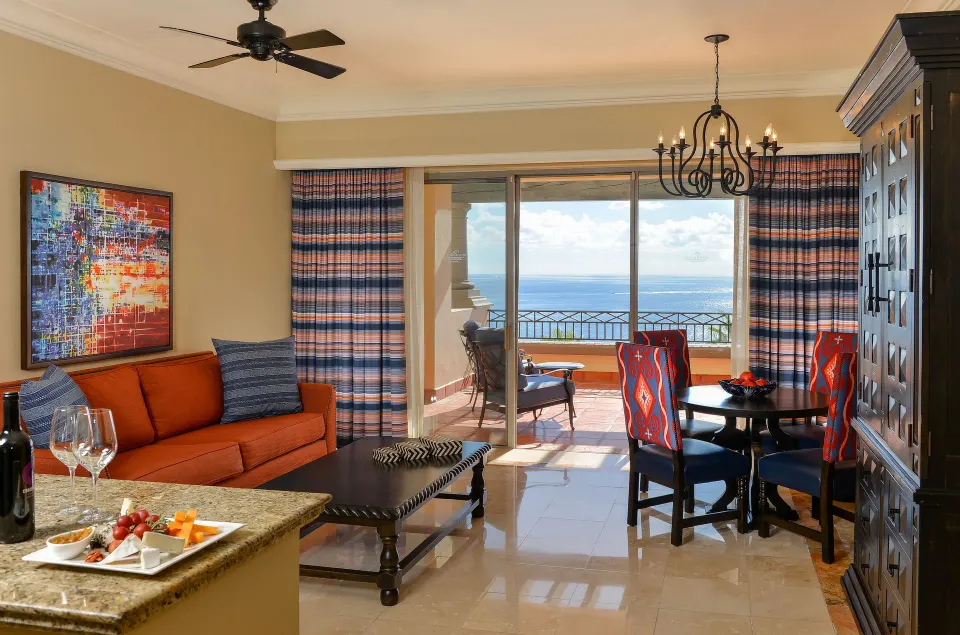 Executive Suite Ocean View living room and balcony view at Pueblo Bonito Sunset Beach Golf & Spa Resort.