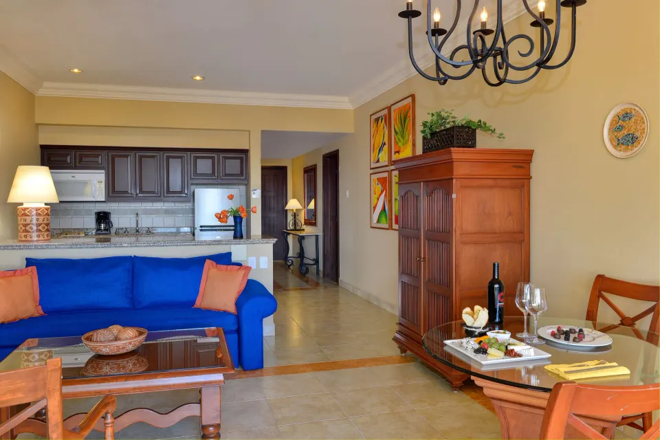 Executive Suite Ocean View lounge, dining table and kitchenette at Pueblo Bonito Sunset Beach Golf & Spa Resort.
