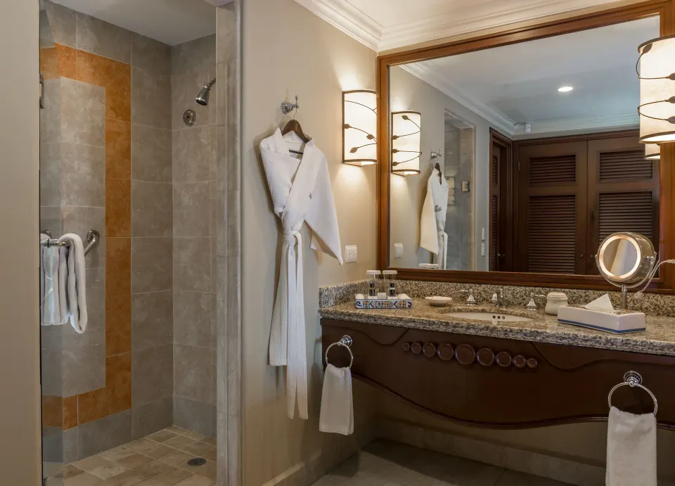 Junior Suite Ocean View bathroom vanity and shower at Pueblo Bonito Sunset Beach Golf & Spa Resort.