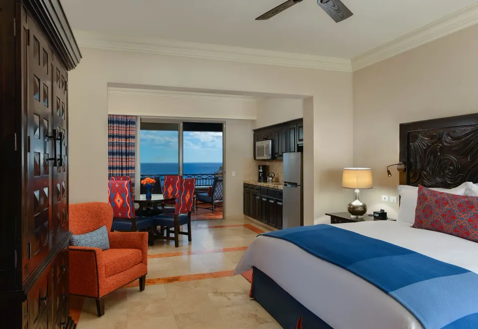 Junior Suite Ocean View king bed and kitchenette at Pueblo Bonito Sunset Beach Golf & Spa Resort.