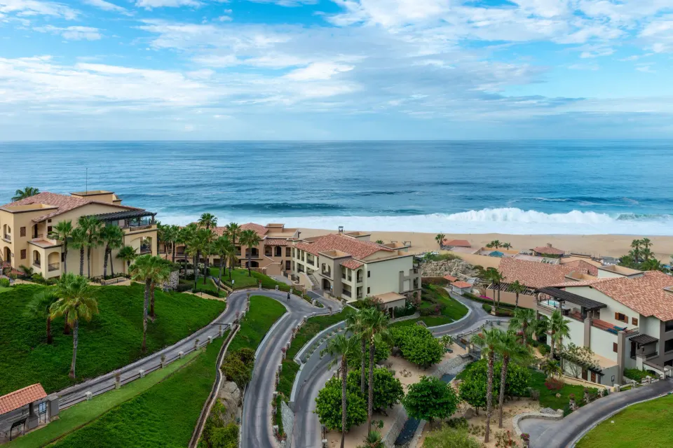Junior Suite Ocean View balcony outlook over resort and ocean at Pueblo Bonito Sunset Beach Golf & Spa Resort.