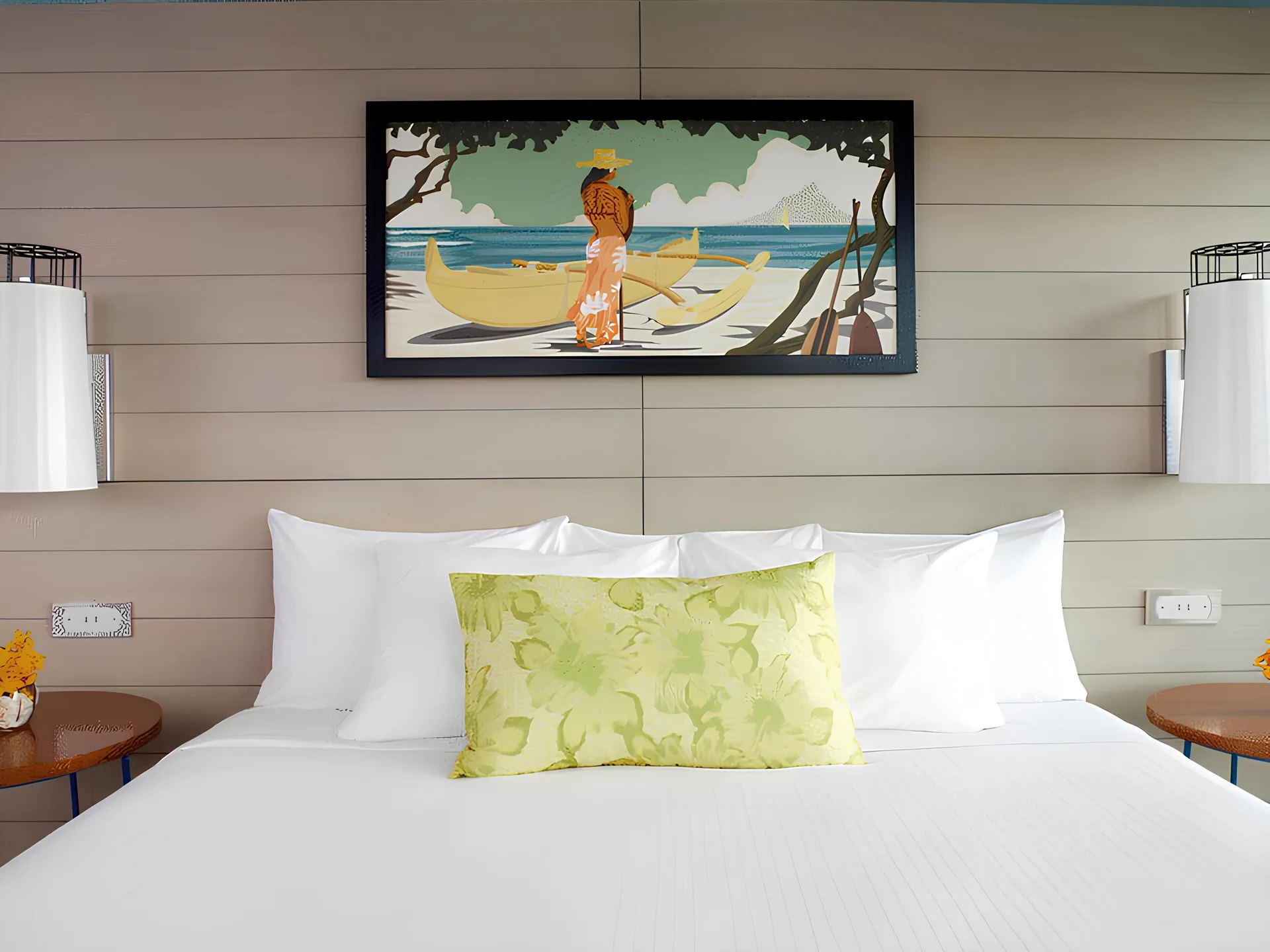 Junior Suite king bed with white linens and wall art at Queen Kapiolani Hotel.