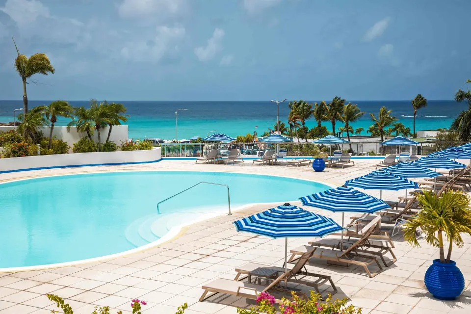 Royal Islander Resort La Terrasse resort-style property with colorful exterior and pool area in Lowlands, Sint Maarten.