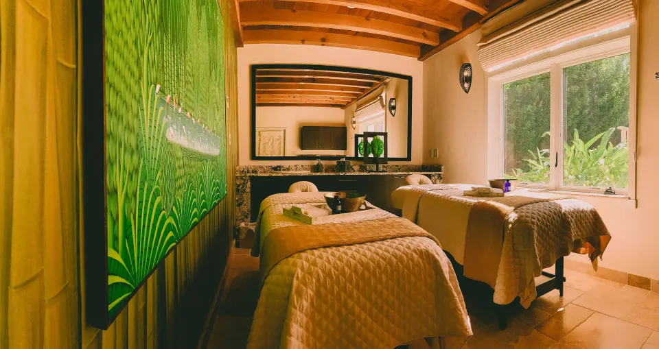 Couples massage room with two treatment tables at Quintessence Hotel.