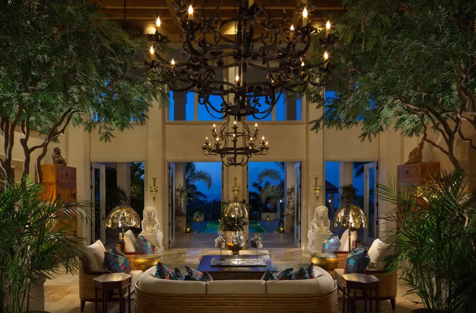 Hotel lobby seating area with chandeliers and open view at Quintessence Hotel