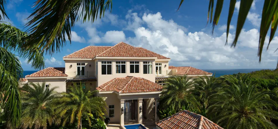 Aerial view of the main resort building and tropical landscaping at Quintessence Hotel
