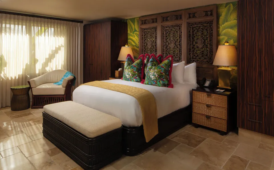 Garden View Meads Bay Standard Suite with king bed and tropical accents at Quintessence Hotel