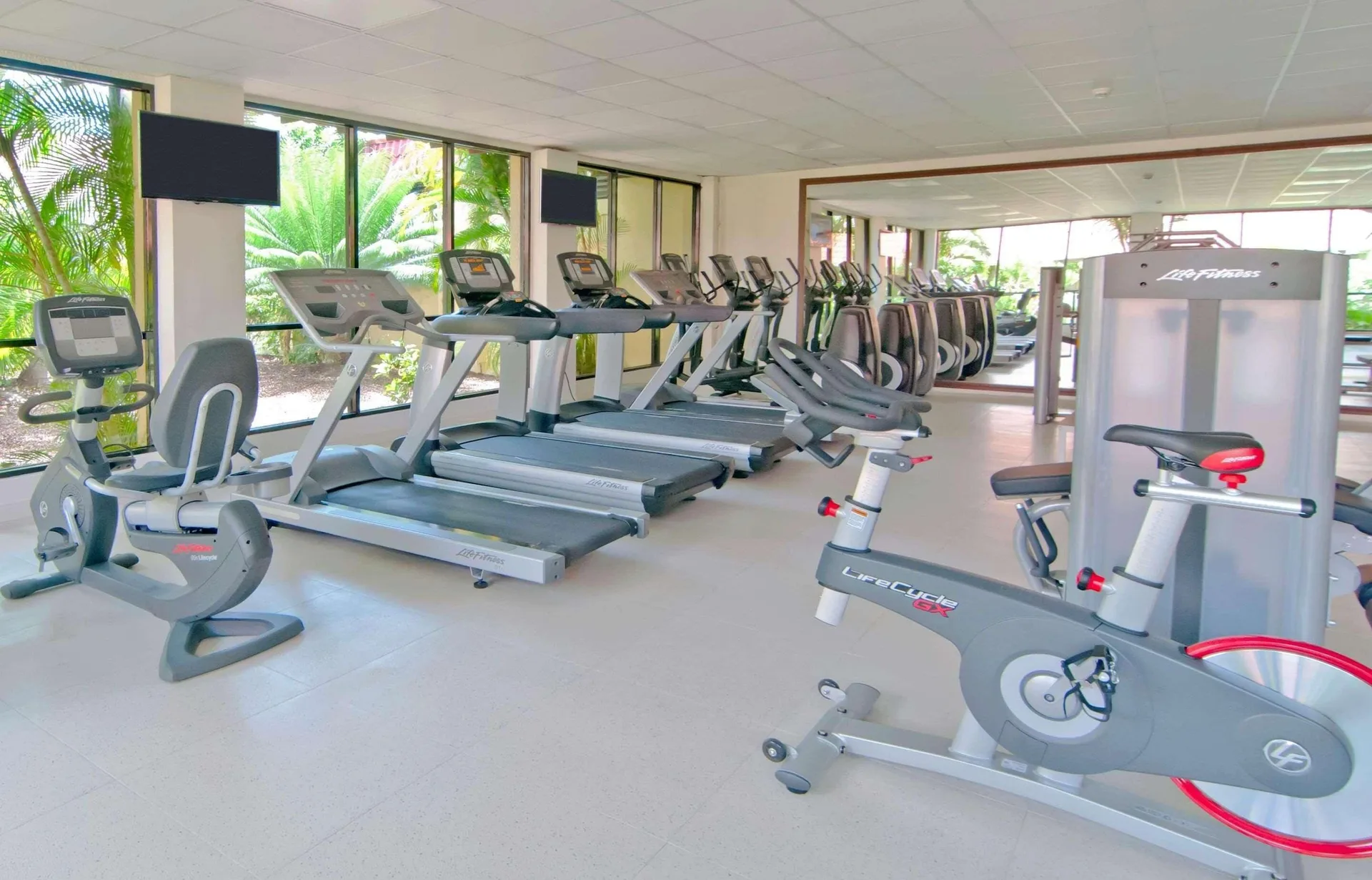 Fitness room with treadmills, bikes and strength equipment at Radisson Grenada Beach Resort.