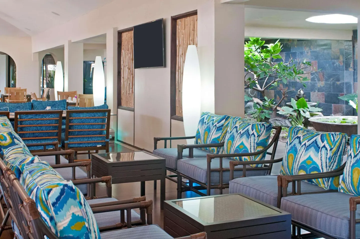 Lobby lounge seating with patterned cushions at Radisson Grenada Beach Resort.