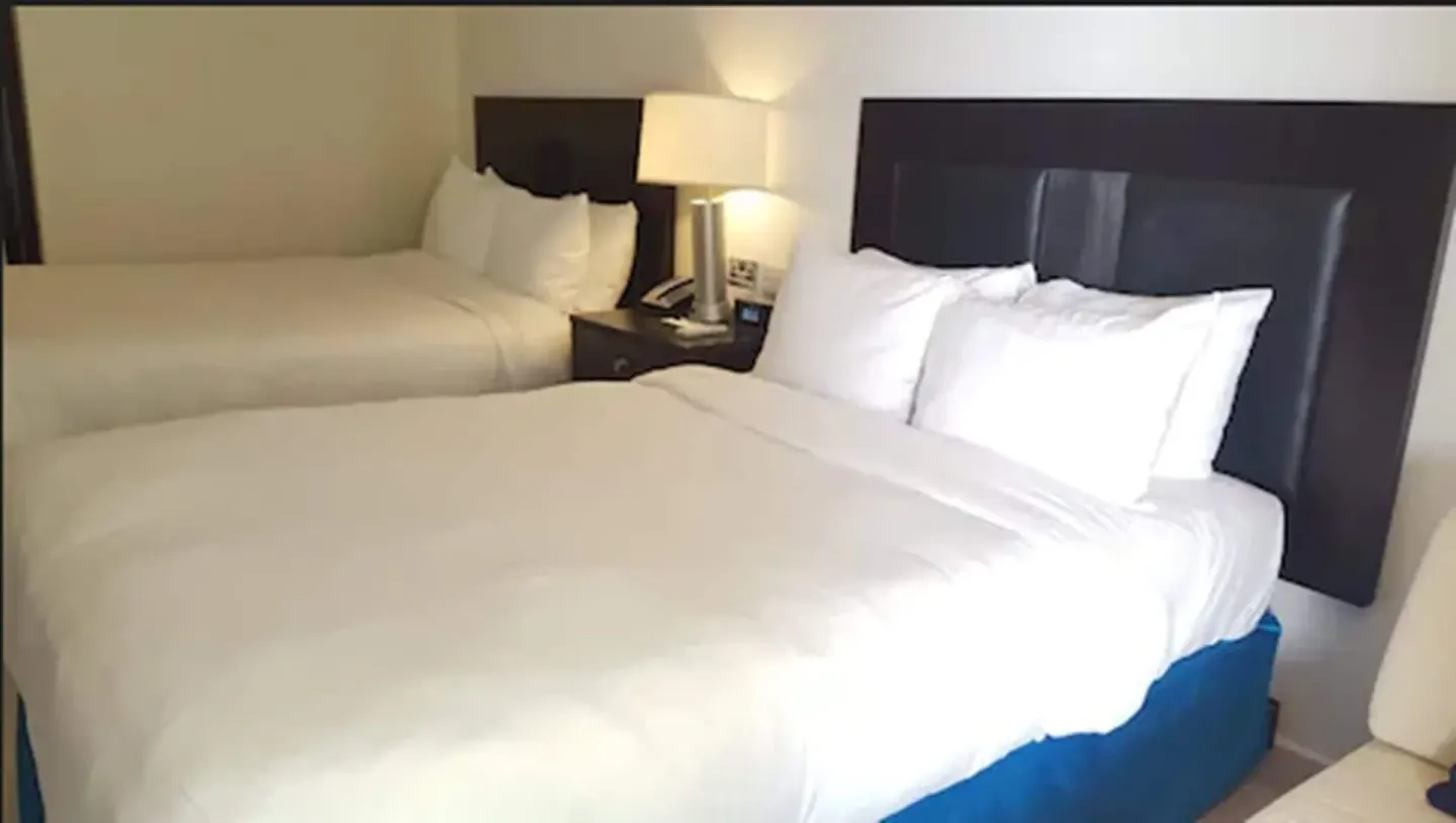 Close view of two double beds in a Non Smoking Executive Beach Front room at Radisson Grenada Beach Resort.