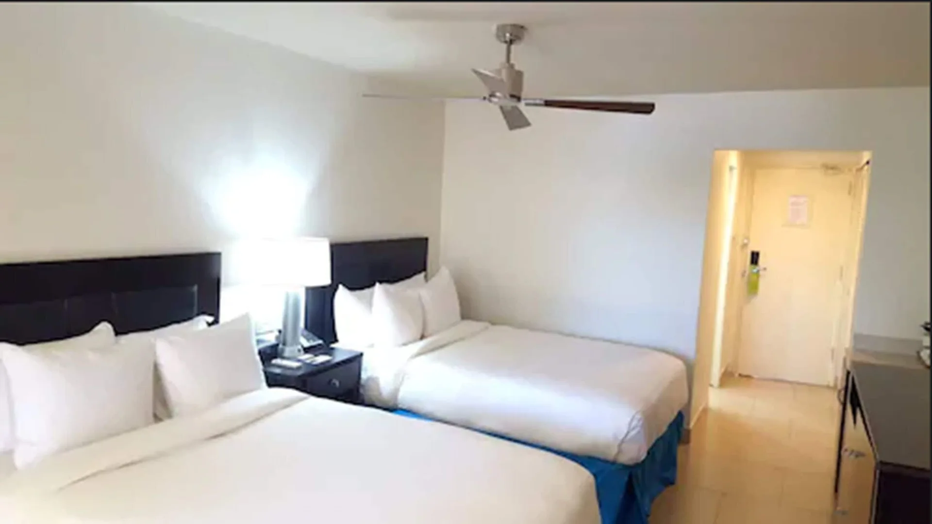 Two double beds in a Non Smoking Executive Beach Front room at Radisson Grenada Beach Resort.
