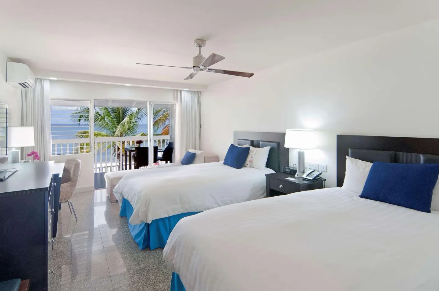 Non Smoking Garden View room with two beds and balcony at Radisson Grenada Beach Resort.