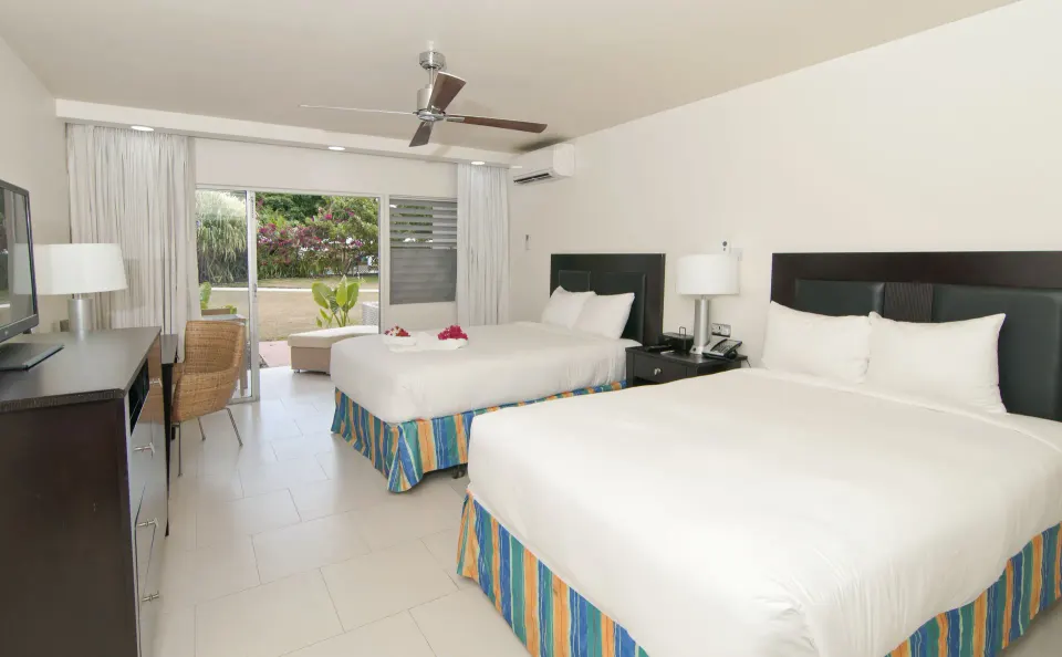 Non Smoking Garden View room with two beds and patio at Radisson Grenada Beach Resort.