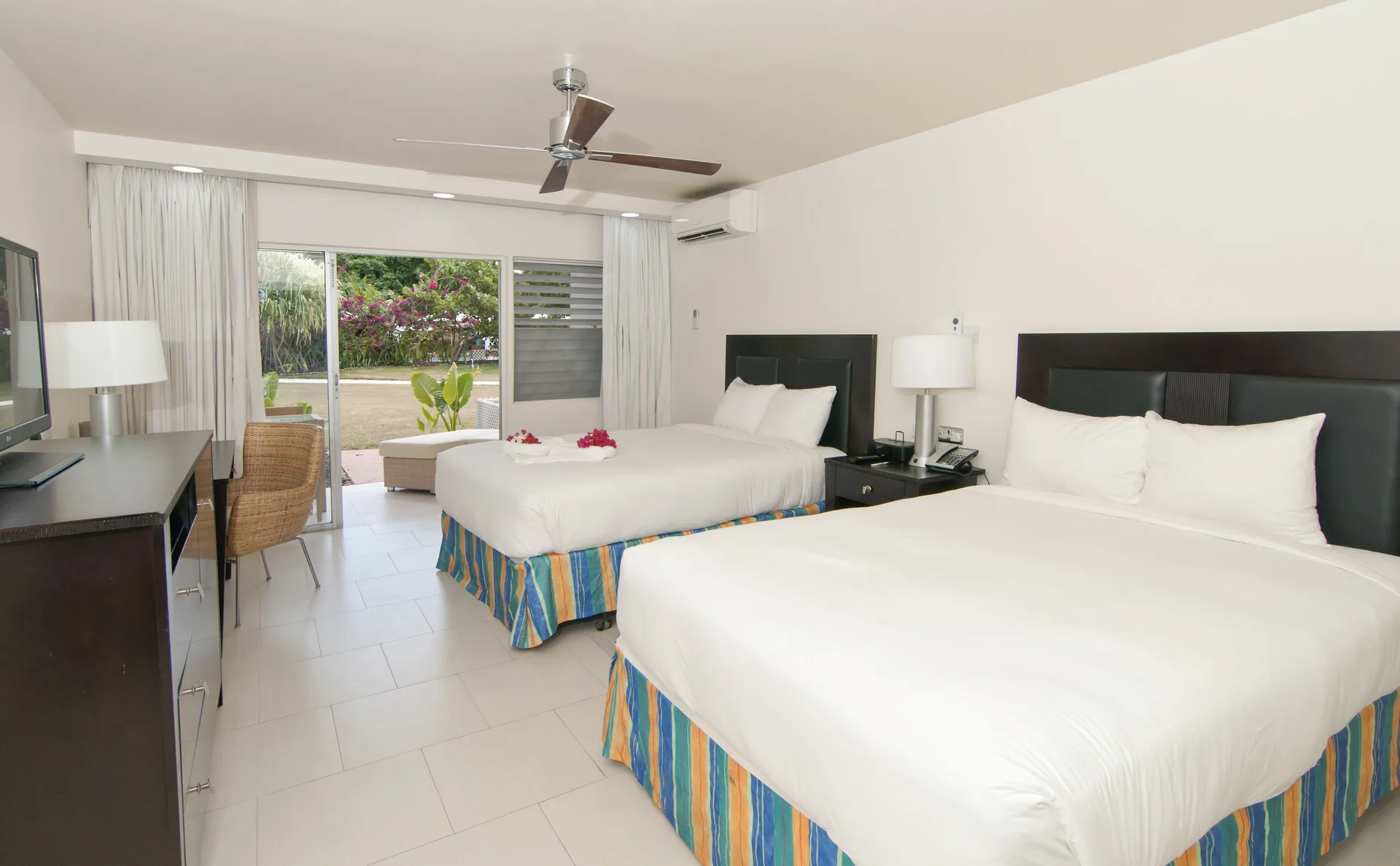 Non Smoking Garden View room with two beds and patio at Radisson Grenada Beach Resort.