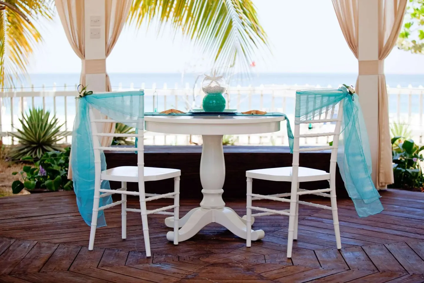 Decorated seaside wedding table at Radisson Grenada Beach Resort.