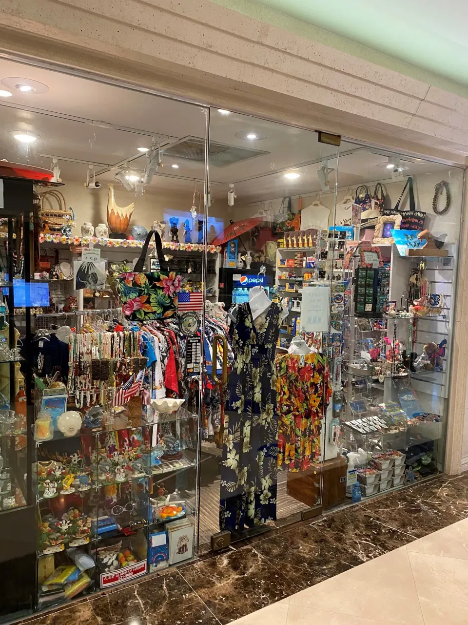 Souvenir shop window with clothing and gifts at Ramada Plaza Waikiki.