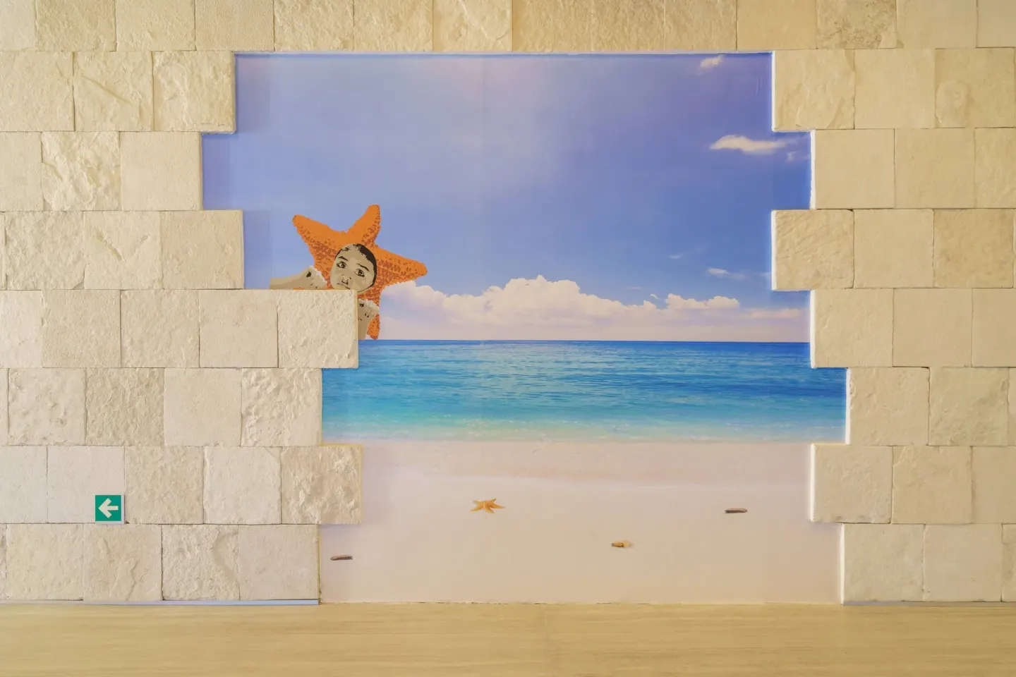 Beach-themed wall art with a starfish figure at Renaissance Cancun Resort & Marina.