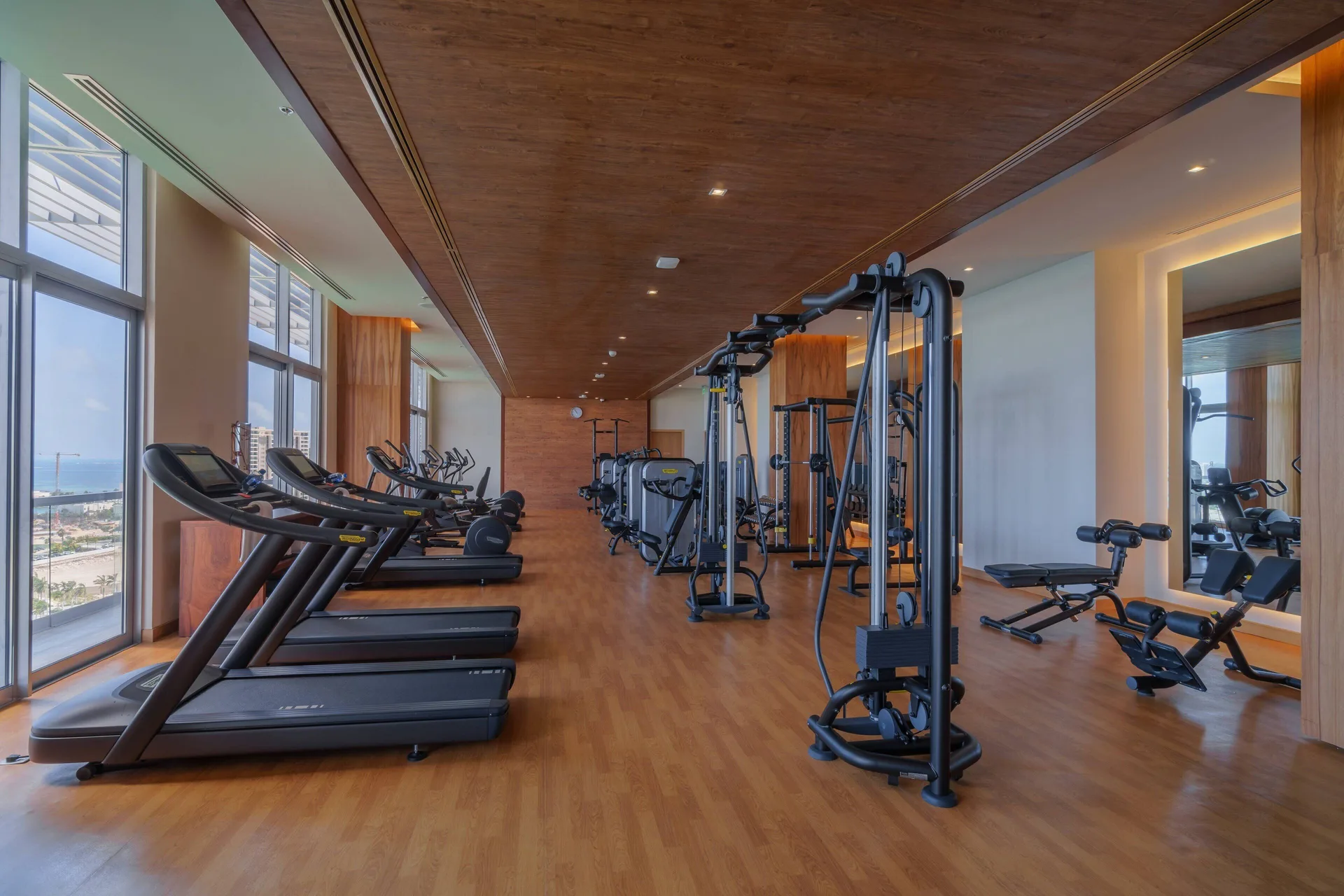 Fitness center with treadmills and cable equipment at Renaissance Cancun Resort & Marina.