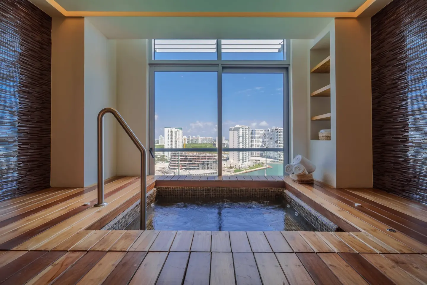 Indoor plunge pool with city and marina views at Renaissance Cancun Resort & Marina.