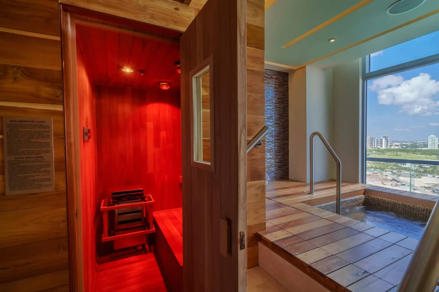 Wood sauna beside an indoor plunge pool at Renaissance Cancun Resort & Marina.