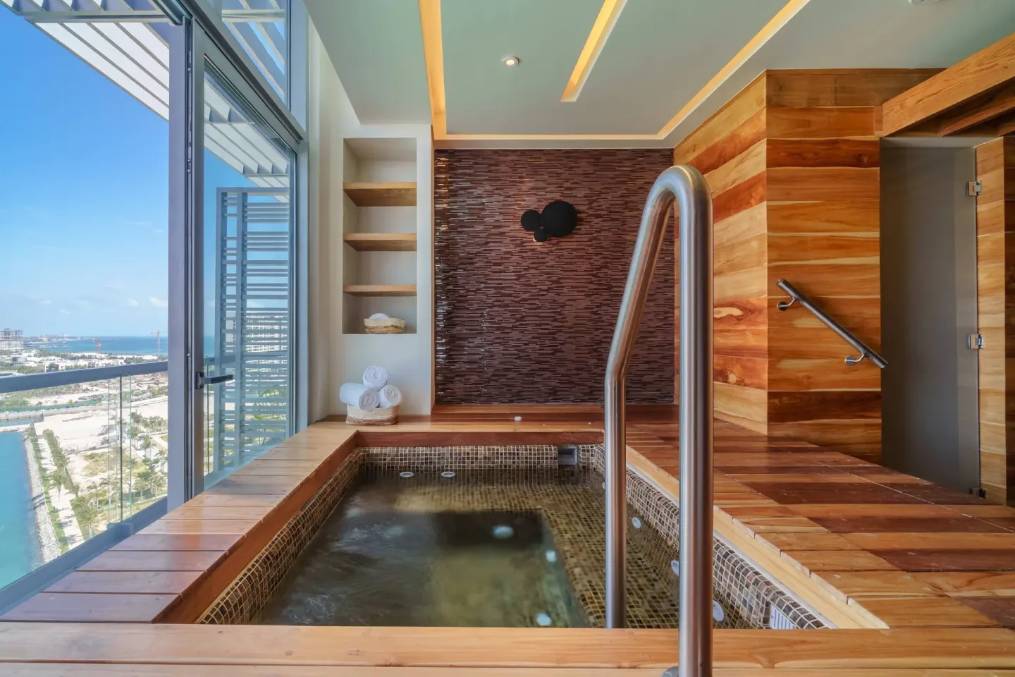 Windowed spa plunge pool with wood decking at Renaissance Cancun Resort & Marina.